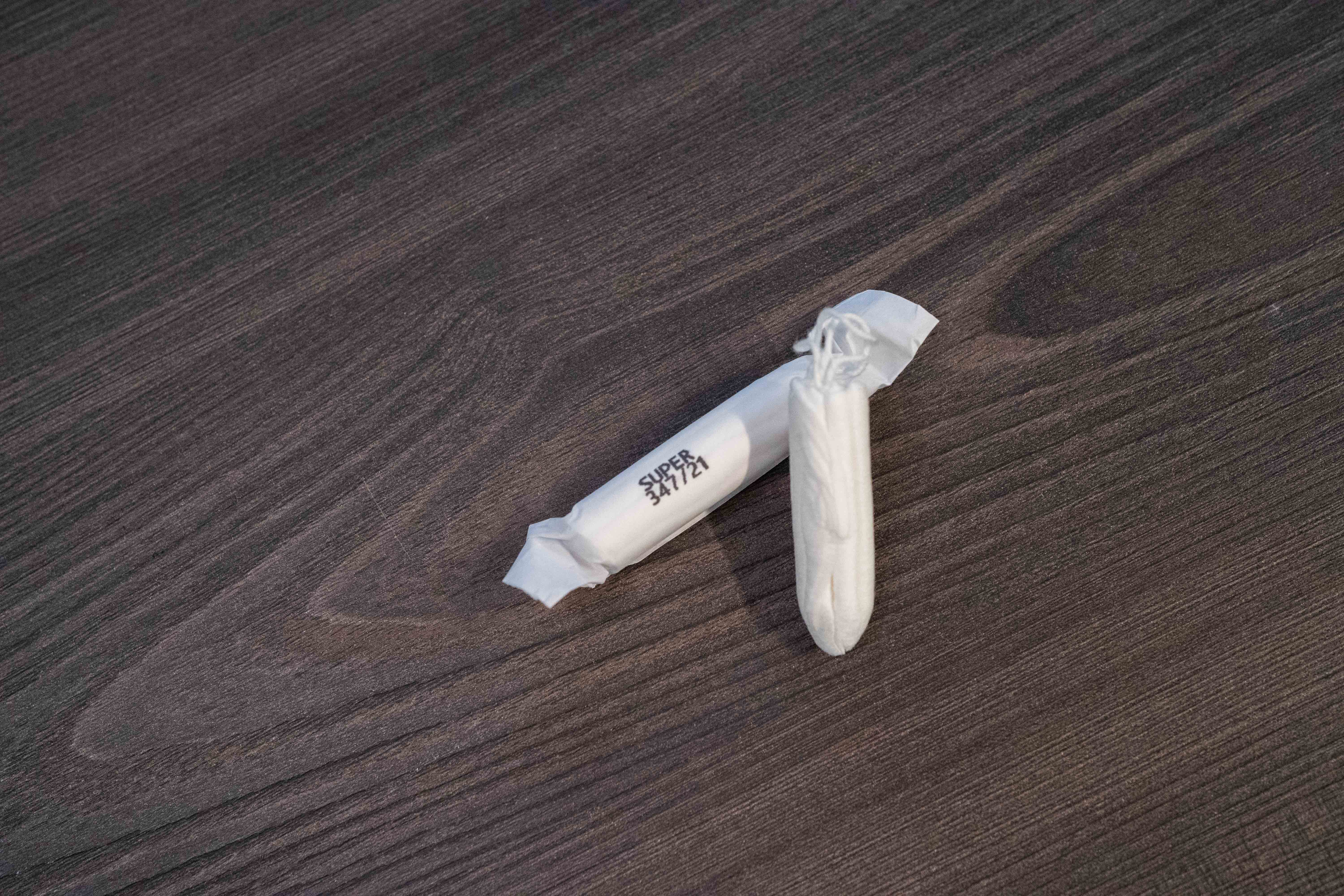 Image of a non-applicator tampon laying on a table.