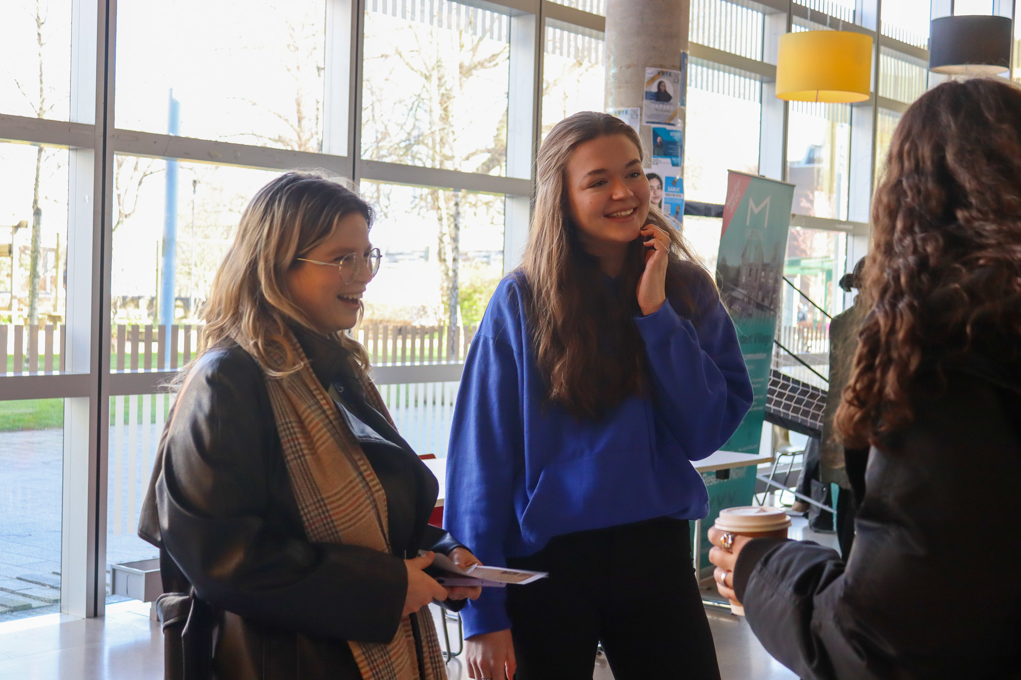 Women students talking with each other.