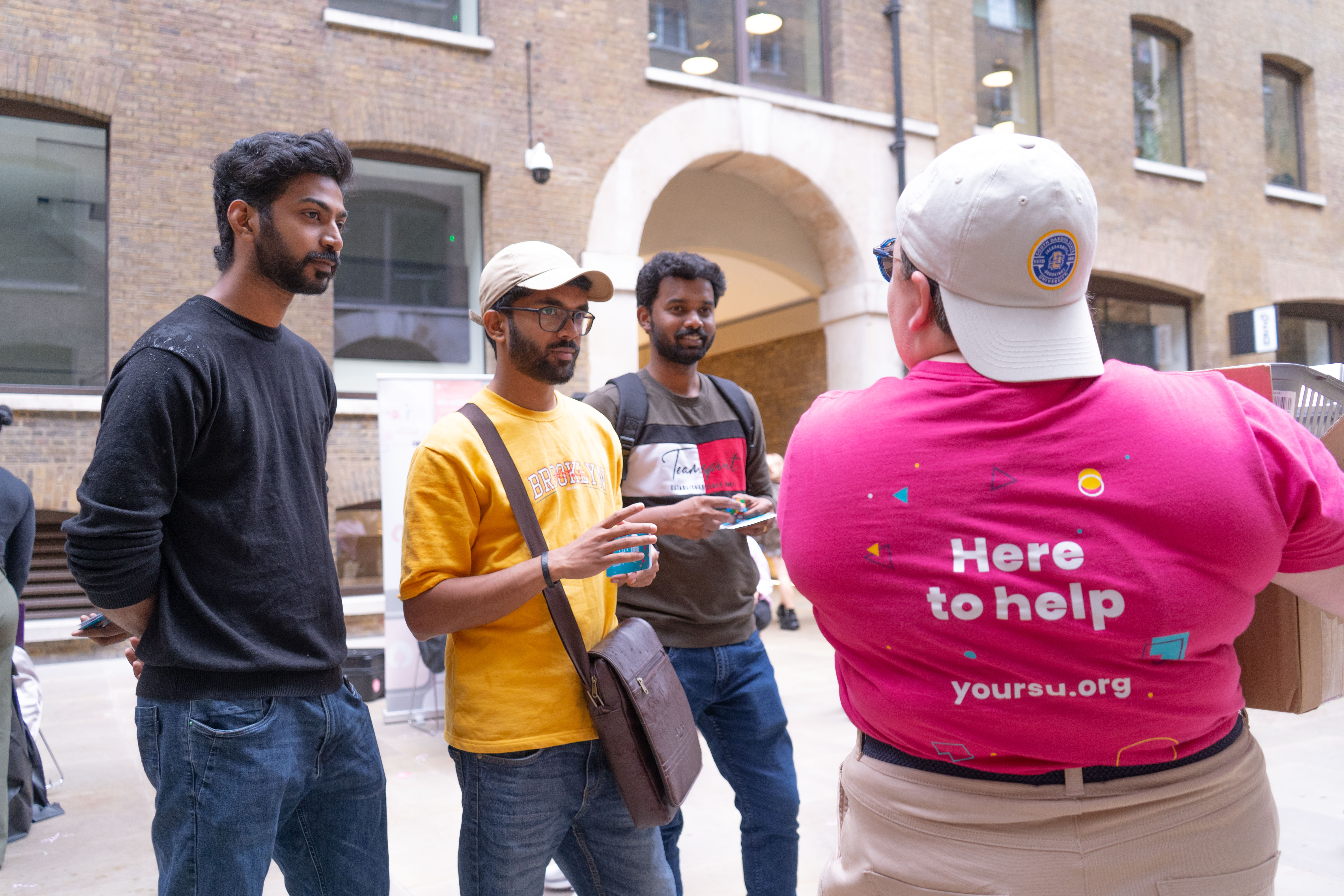 Four people having a conversation.