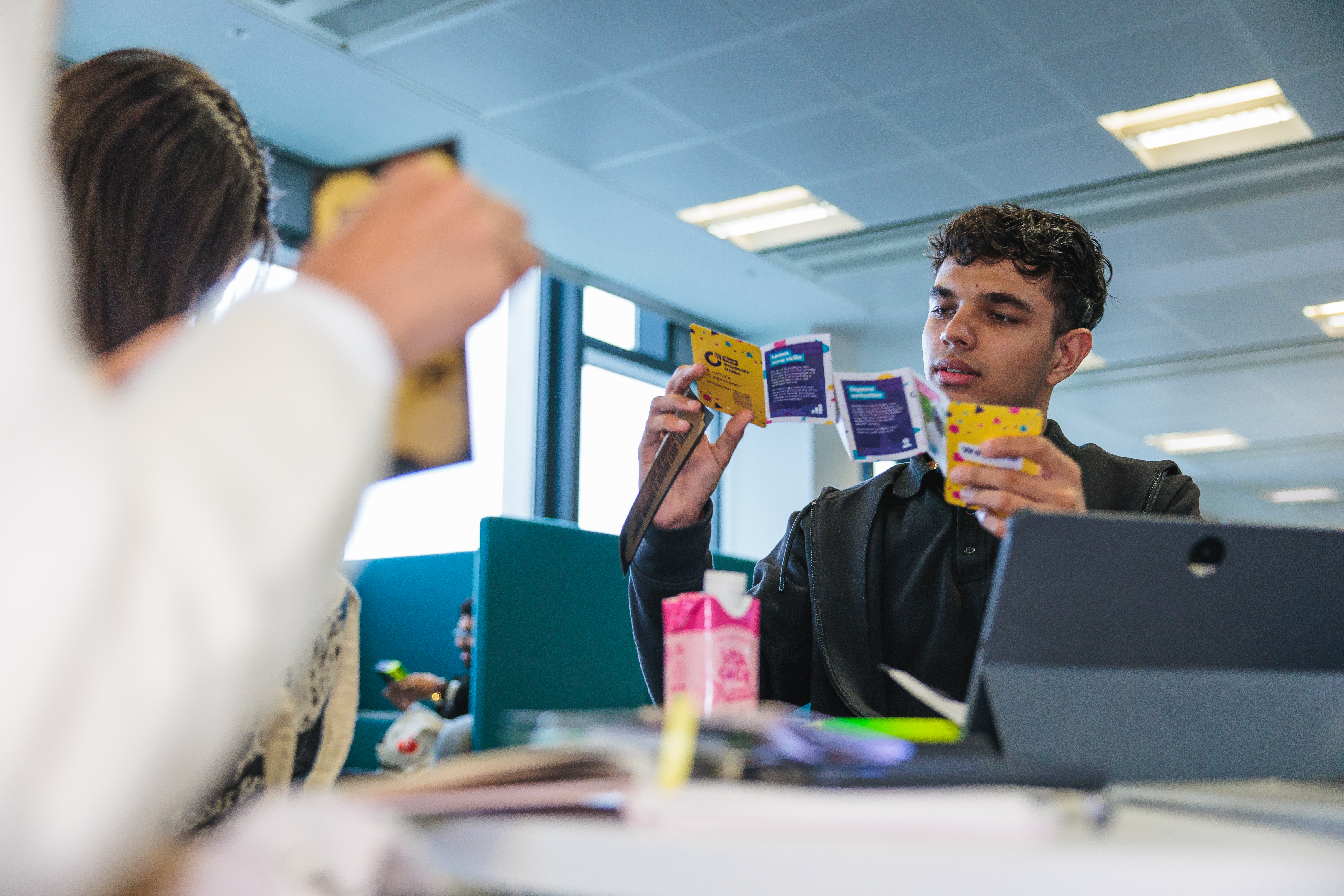 A person looking through Welcome-branded information.