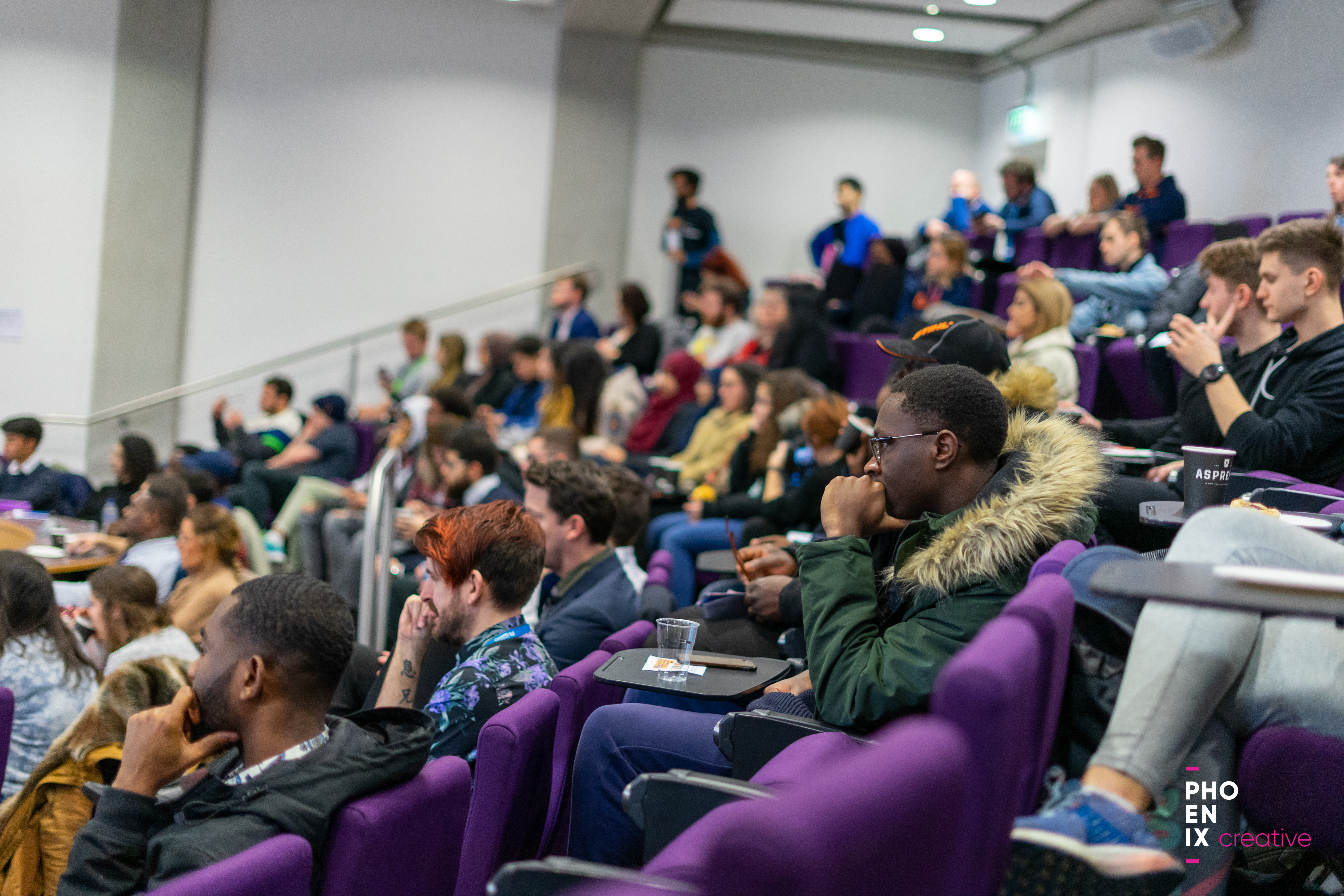 A group of students sitting in a lecture.